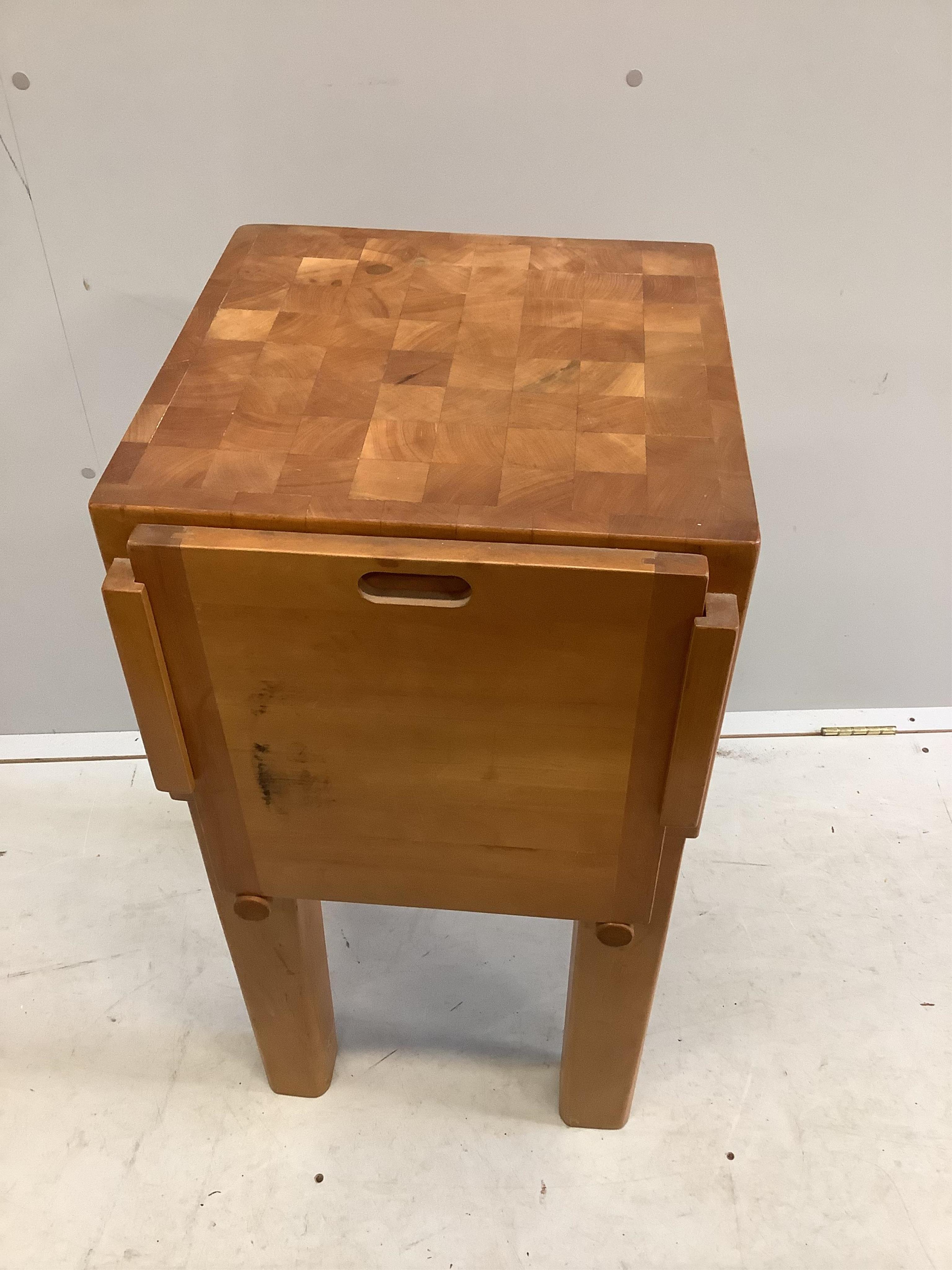 A modern beech butcher's block, width 42cm, depth 44cm, height 82cm. Condition - fair